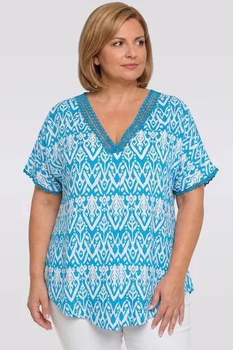 Modra bluza z belimi vzorci